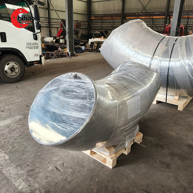 Real photo of large size long radius elbows wrapped for shipping, carbon steel seamless pipe elbows, factory packaged for industrial pipeline projects.