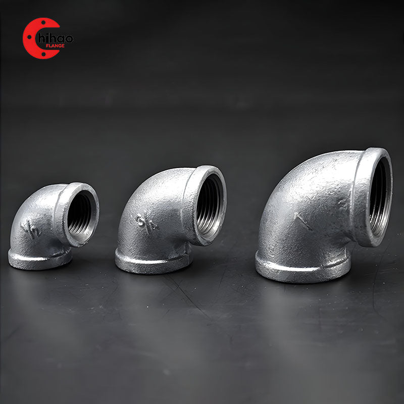 Set of galvanized malleable iron 90-degree threaded elbows in three sizes (1/3", 3/4", 1"), female NPT pipe fittings for low-pressure plumbing, gas, and fire sprinkler systems.